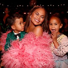 Miles Stephens, Chrissy Teigen, and Luna Stephens attend the 64th Annual GRAMMY Awards at MGM Grand Garden Arena on April 03, 2022 in Las Vegas, Nevada.