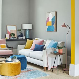 best colour combinations, Grey wall with sofa and pillows, yellow accents