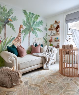 A nursery bedroom with wall mural depicting wild animals in a savannah and woody neutral furniture and accents.