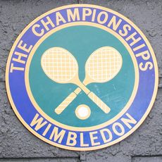 Wimbledon with logo and tennis bat with tennis ball