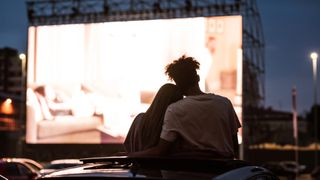 Couple at drive in cinema