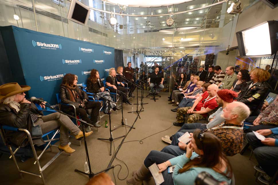 Aerosmith facing interviewers at SiriusXM's Town Hall With Aerosmith live on Classic Vinyl at SiriusXM Studios on November 2, 2012 in New York City