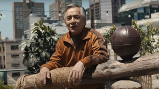 Jackie Chan outside on rooftop as Mr. Han in Karate Kid: Legends