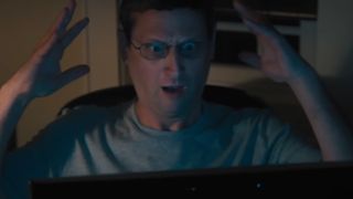 Tim Robinson as Ron Trosper, looking shocked