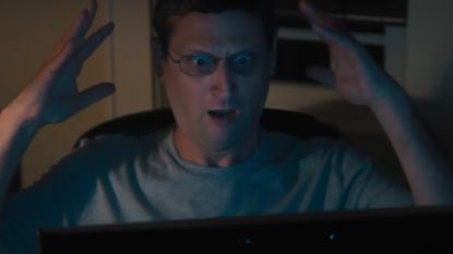 Tim Robinson as Ron Trosper, looking shocked