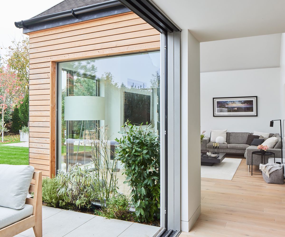 Glass sliding roods open fully out onto a patio