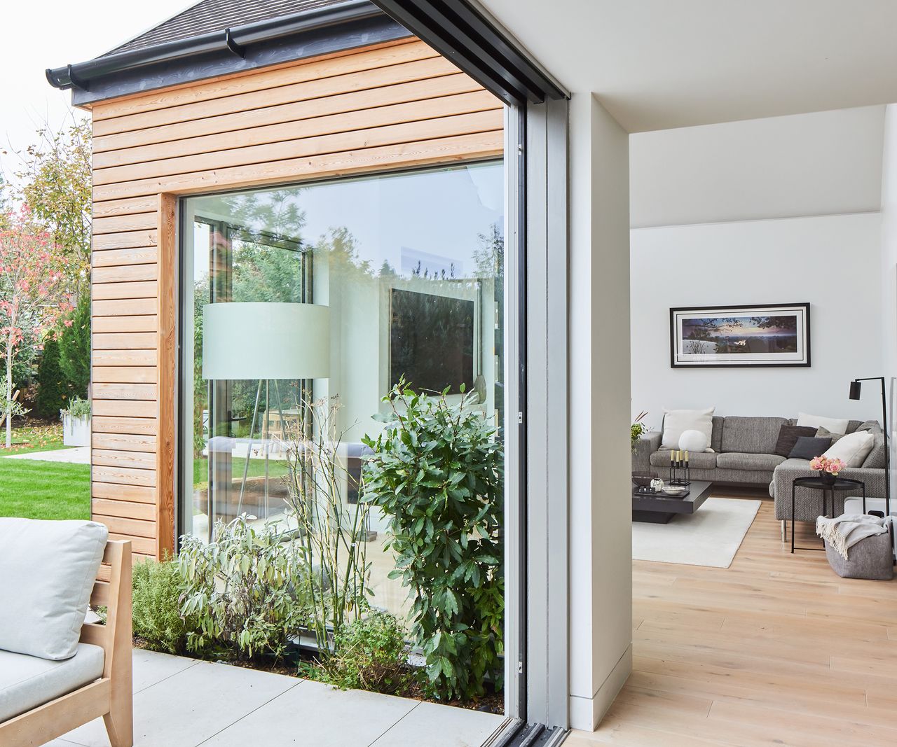 Glass sliding roods open fully out onto a patio