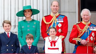 Prince George of Wales, Catherine, Princess of Wales (Colonel of the Irish Guards), Prince Louis of Wales, Princess Charlotte of Wales, Prince William, Prince of Wales and King Charles watch an RAF flypast