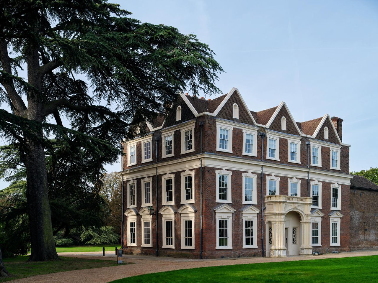 Fig 1: The East and South fronts of Boston Manor, Brentford. The porch was added in the 1840s. Photo: Will Pryce for Country Life.