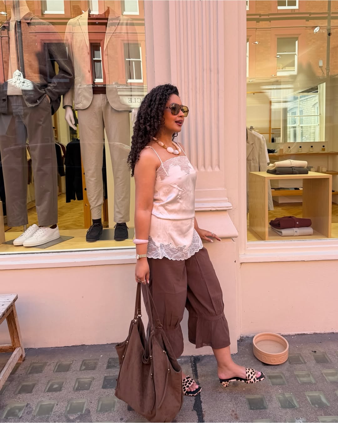 Influencer Layla Abbey wearing a lace camisole, bloomers and heeled mules.