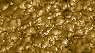 Golden blobs over a dark background