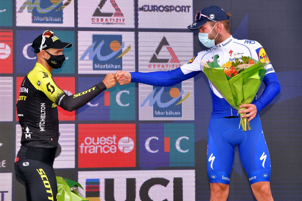 PLOUAY FRANCE AUGUST 25 Podium Luka Mezgec of Slovenia and Team Mitchelton Scott Florian Senechal of France and Team Deceuninck QuickStep Celebration Flowers Mask Covid safety measures during the 84th Bretagne Classic OuestFrance 2020 a 2478km race from Plouay to Plouay GrandPrixPlouay GPPlouay on August 25 2020 in Plouay France Photo by Luc ClaessenGetty Images