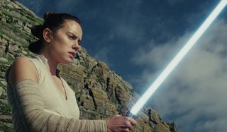 Star Wars: The Last Jedi Rey admiring her lightsaber