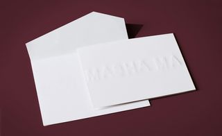 primitive de-bossing technique on white paper raised the letters far off the card