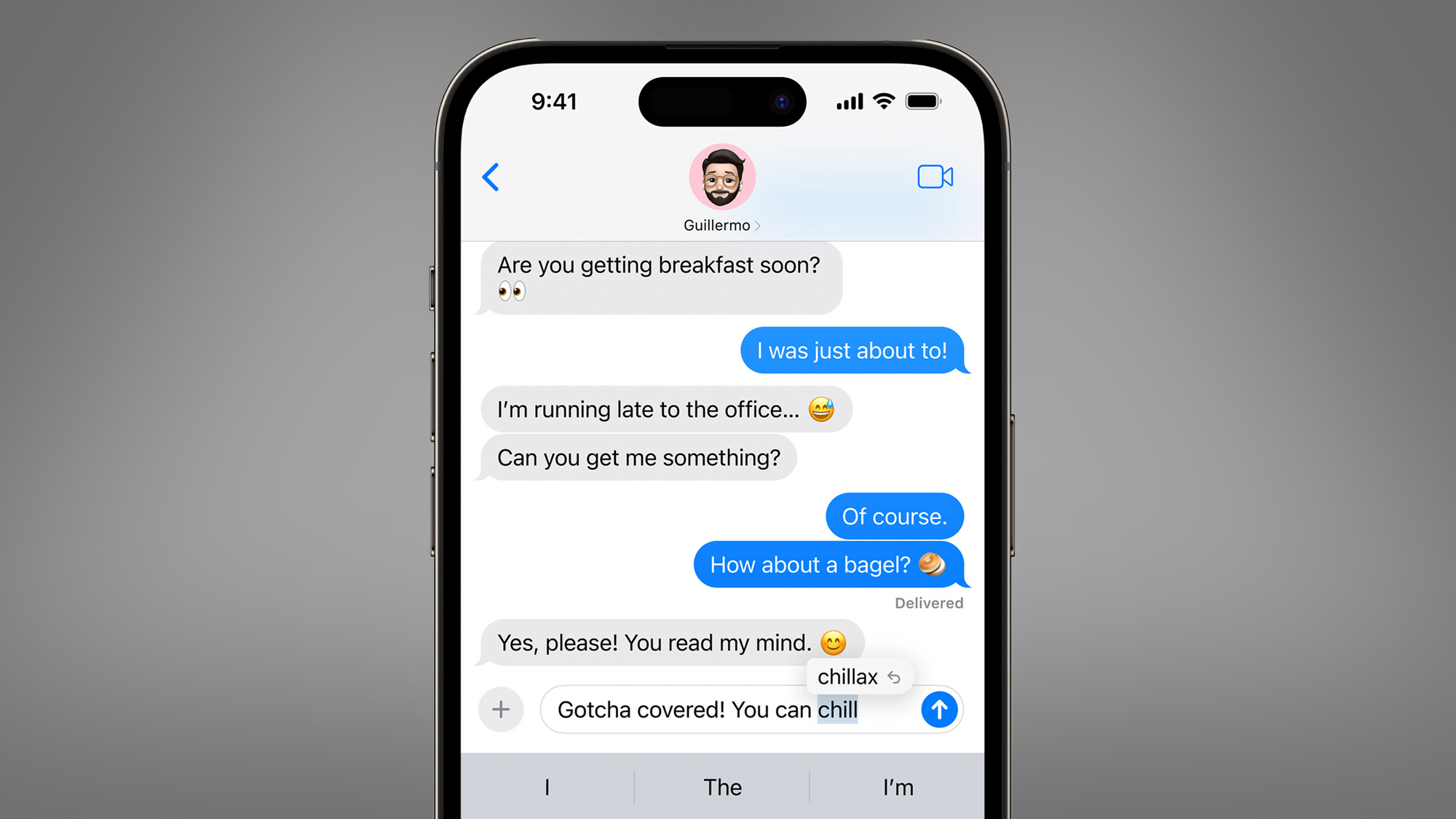 An iPhone on a grey background showing a conversation with autocorrect