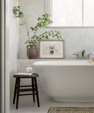 Neutral and minimal bathroom with wooden stool