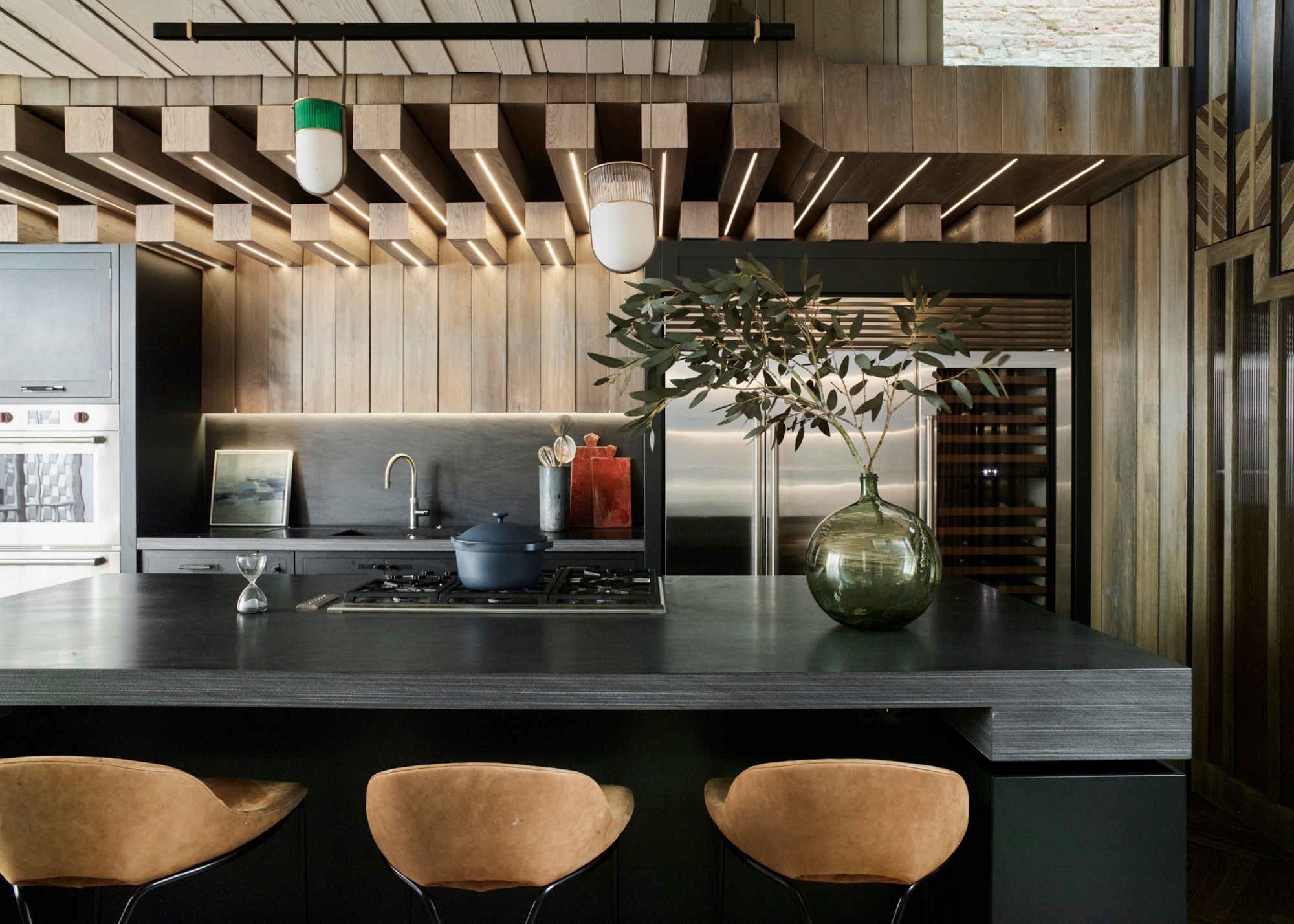 A black wood kitchen with a black wood countertop