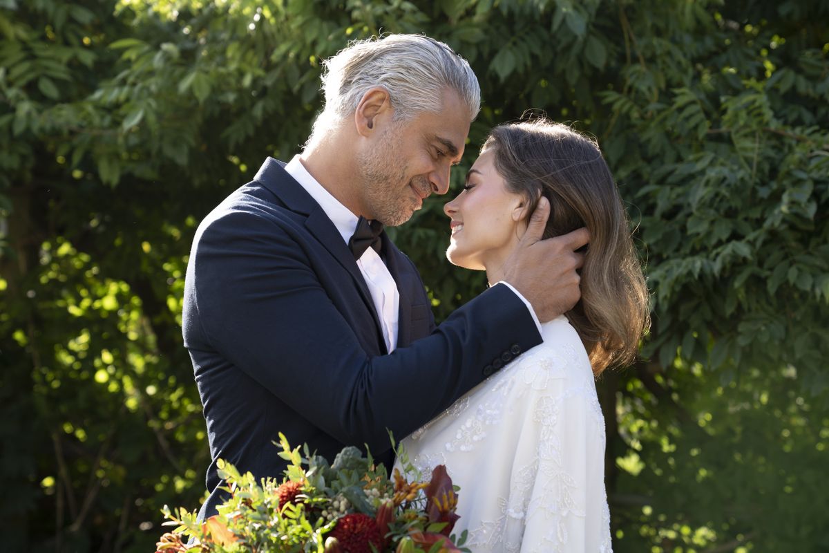 A bride and groom in a park