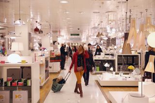 Shoppers peruse products inside the flagship branch of the department store John Lewis in Oxford Street on January 2, 2014 in London, England.