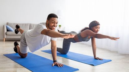 Two people doing a core workout