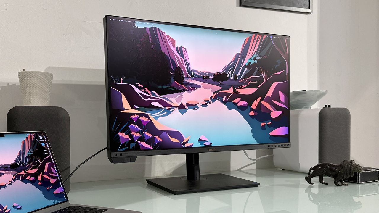 The Asus ProArt PA32KCX 8K monitor on a white desk in a home office during our review process