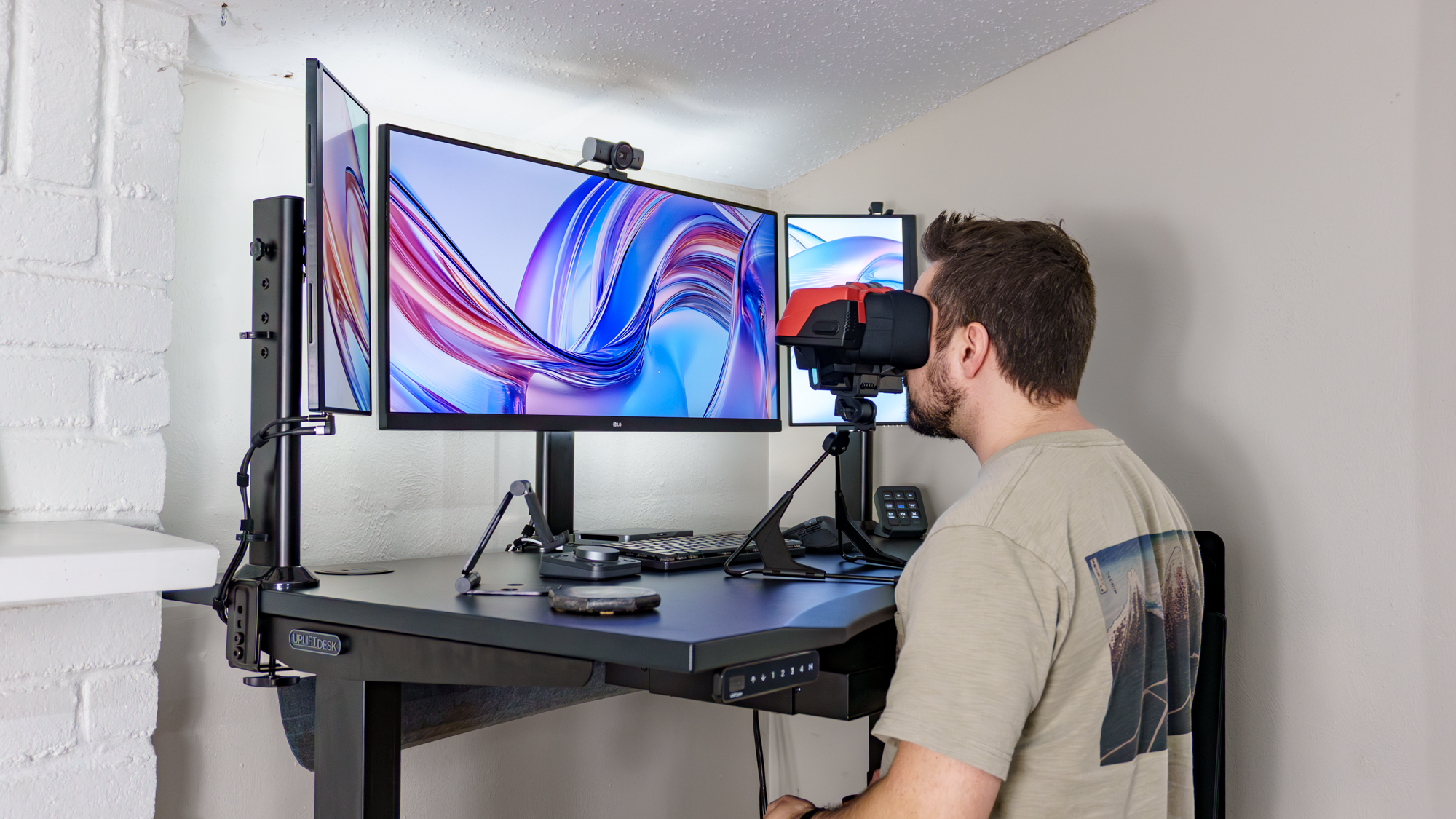 A person playing Virtual Boy at a standing desk raised to max height