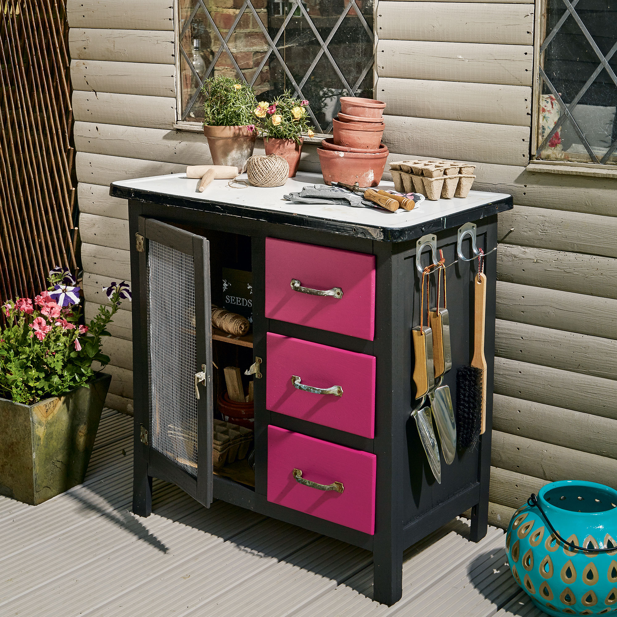Upcycled black and pink potting bench