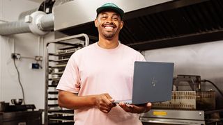 Bakery founder holds a HP Omnibook Ultra with Snapdragon X2 Elite