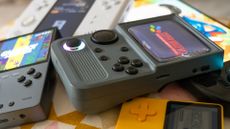 Retro gaming handhelds in a pile