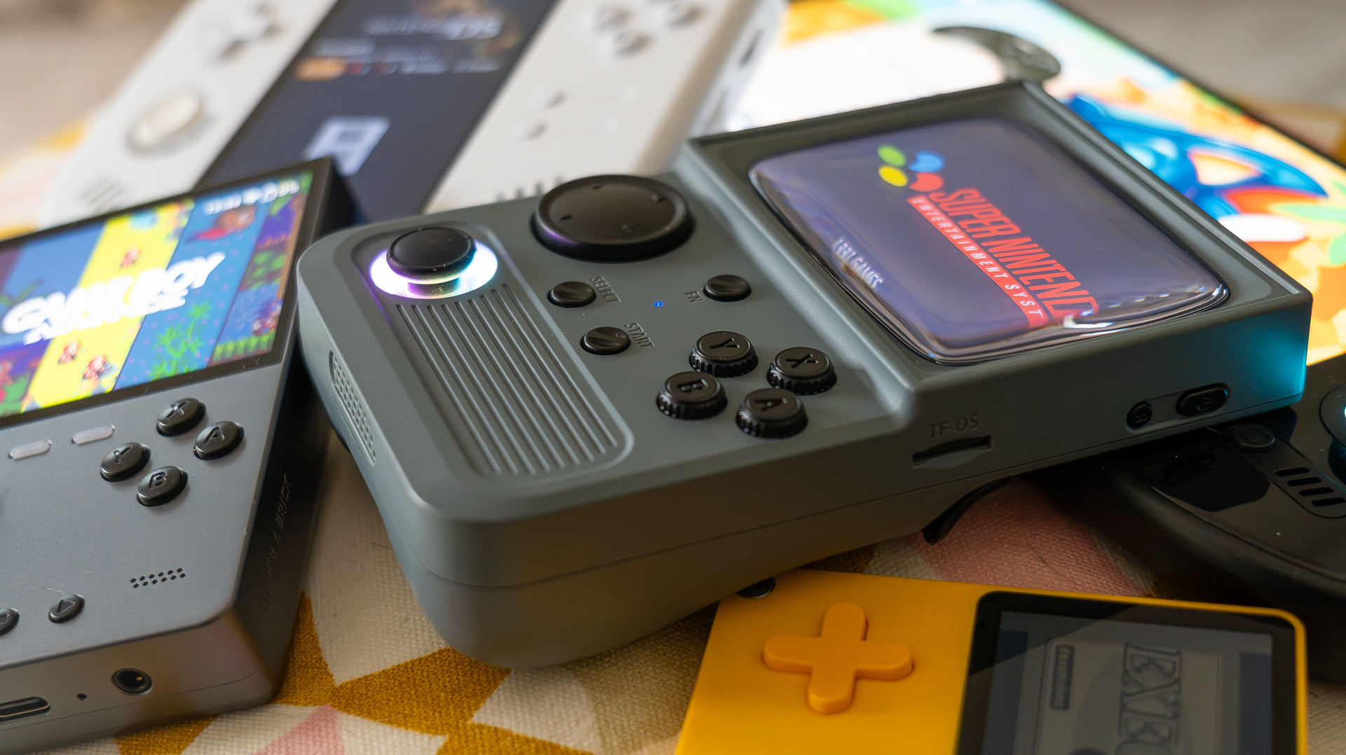 Retro gaming handhelds in a pile