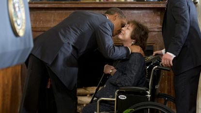 Barack Obama greets Natoma Canfield.