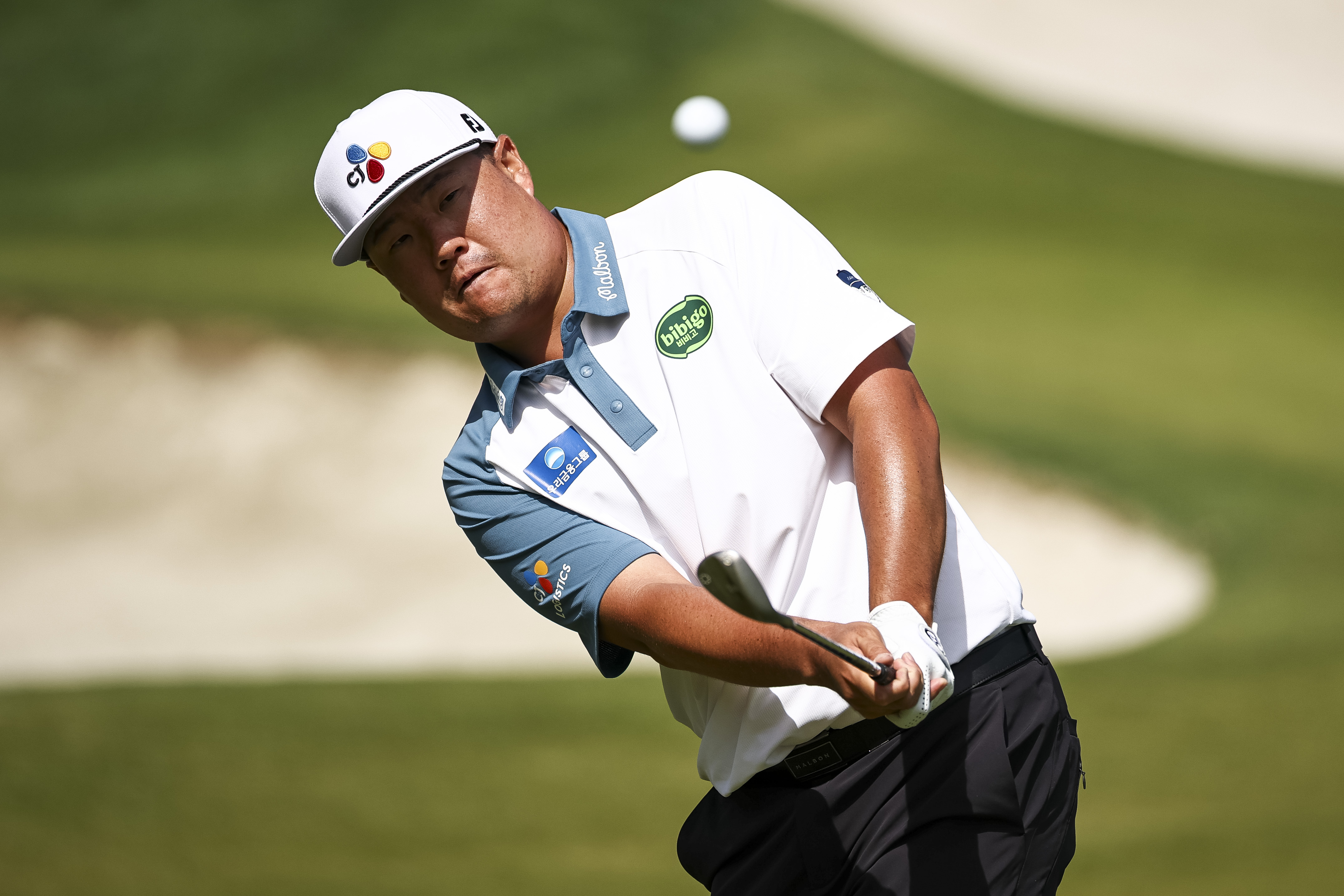 Sungjae Im hits a chip shot on the 15th hole during the second round of the Truist Championship