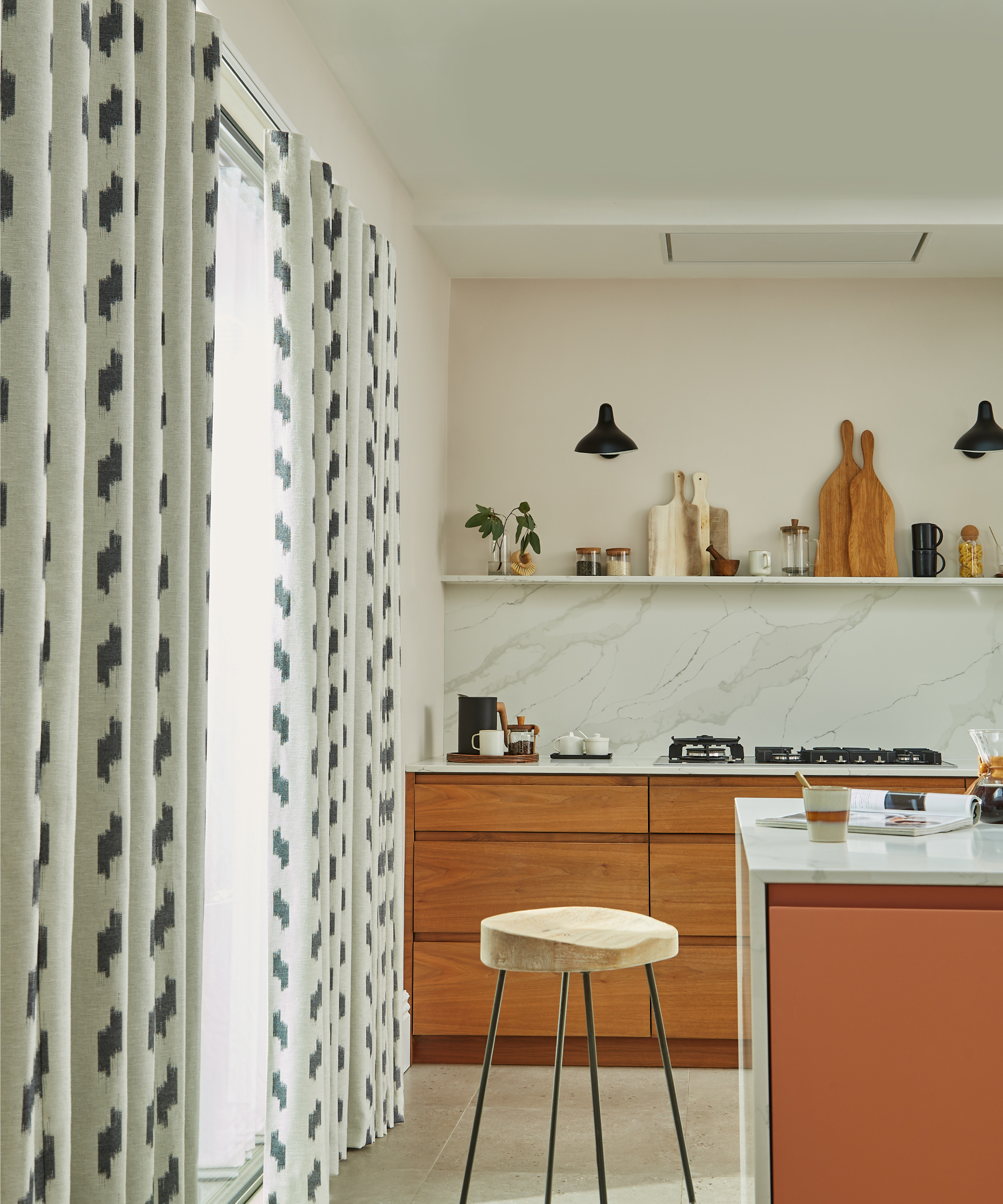 blue and white patterned full length curtains in small kitchen