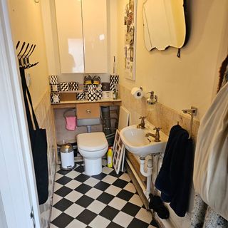 Before shot of a small and dark cloakroom