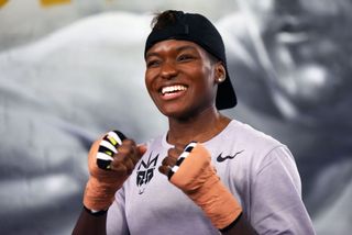Nicola Adams training and wearing boxing gloves