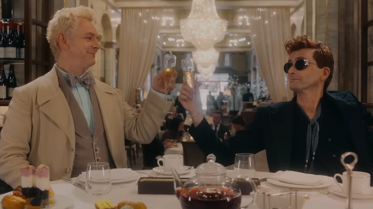 Aziraphale and Crowley clink their glasses together in an image from the Good Omens Season 3 finale.