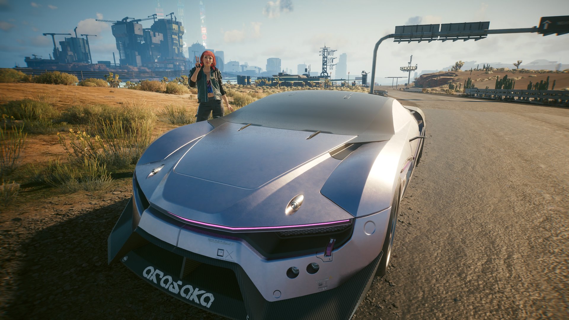 Cyberpunk 2077 2.3 update screenshot of V posing next to the new Rayfield Caliburn Mordred car