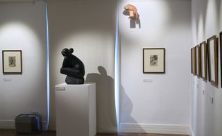 Through a Hole is found grasping towards the one other sculpture in the room, Emilio Greco’s Crouching Nude