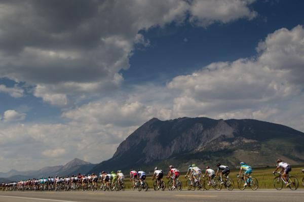The field gets strung out as Crested Butte looms in the distance