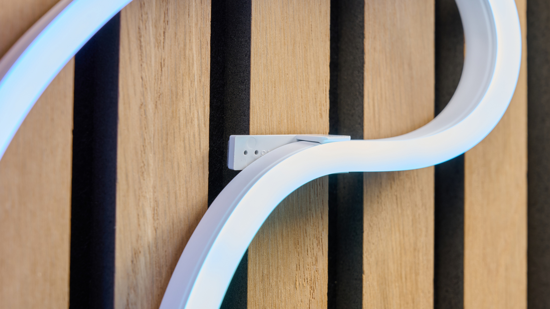 A close-up showing how visible the mounting bracket is where Nanoleaf the rope light bends.