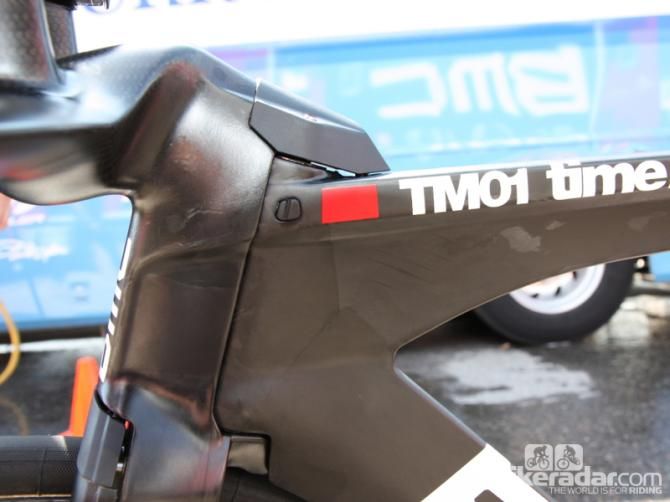 Just to the left of the red paint is a rubber bumper to prevent the integrated fork fairing from hitting the frame