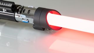 The SabersPro Vader lightsaber with blade installed and ignited.