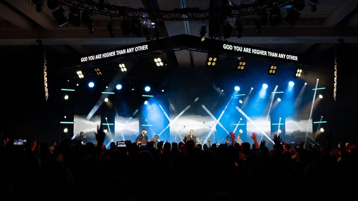 A stage lit by elektraLite solutions at the annual house-of-worship event.