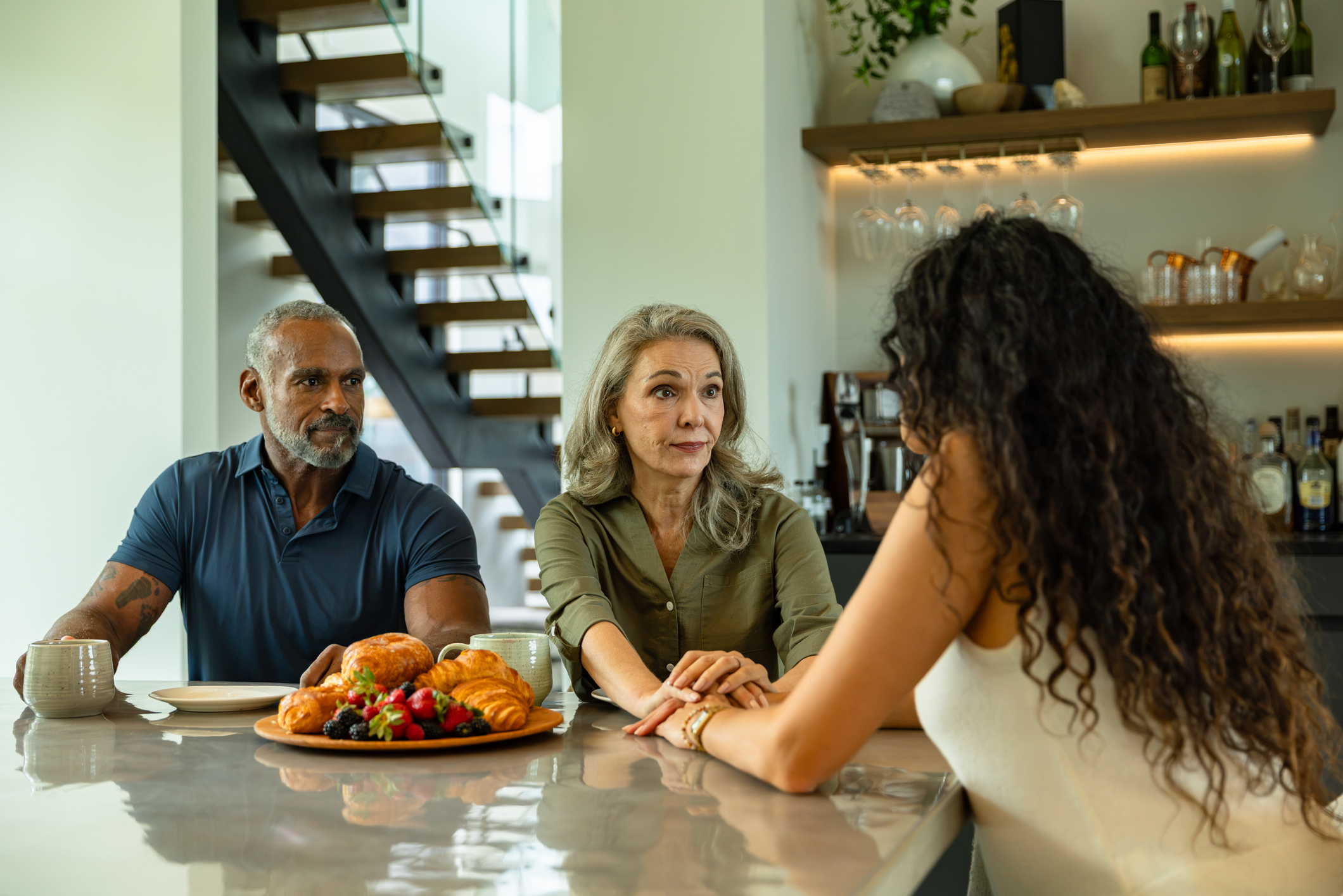 Older couple having a talk with adult child