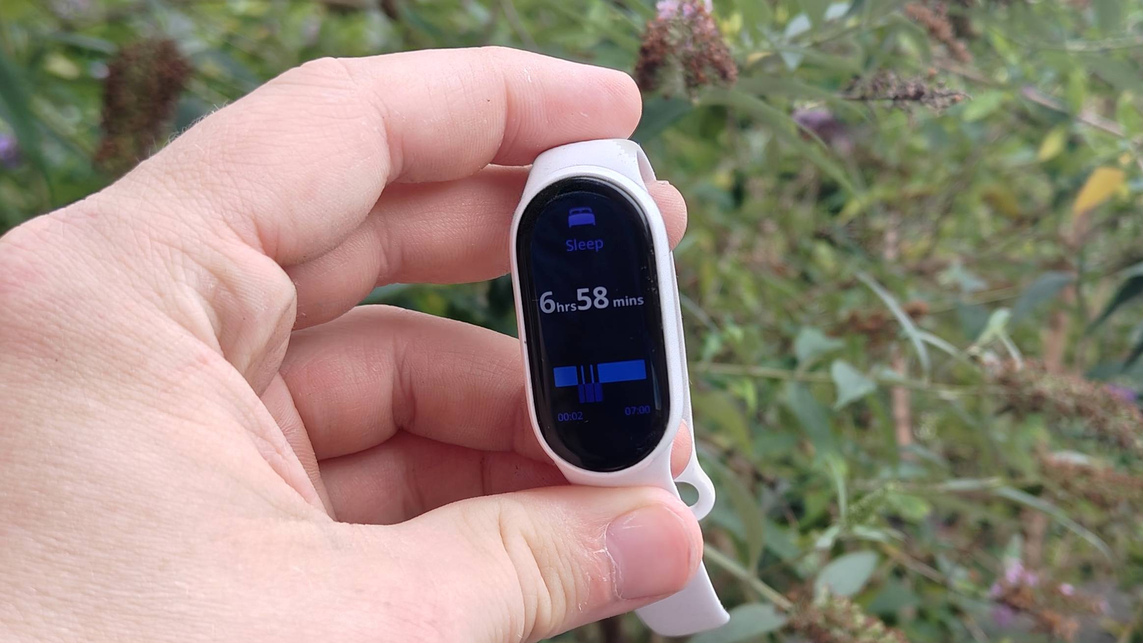 The Xiaomi Smart Band 10 showing sleep tracking metrics.