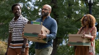 Jeffrey Wright's Monk carries a box alongside Clifford (Sterling K Brown) and Coraline (Erika Alexander). 