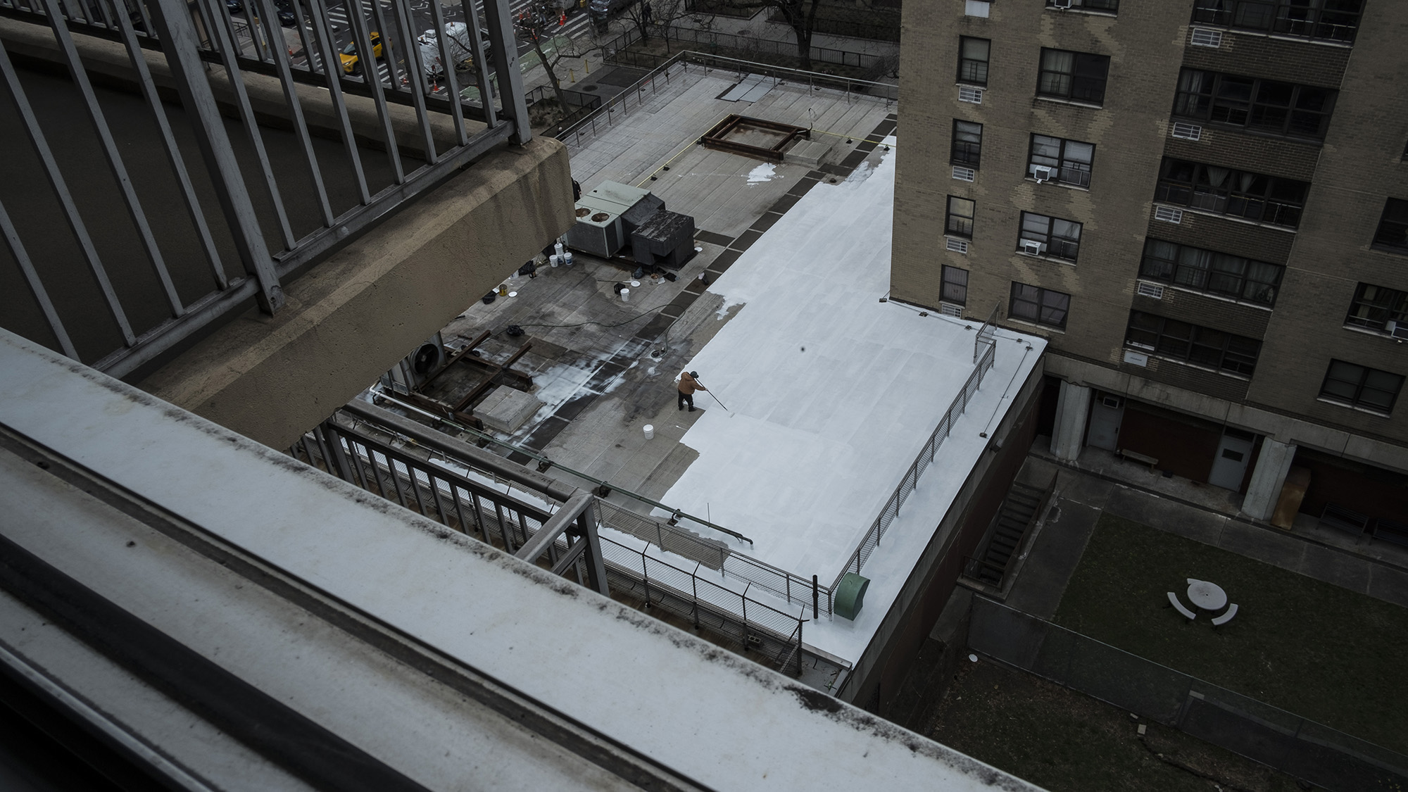 A view of a white roof in the middle of a city
