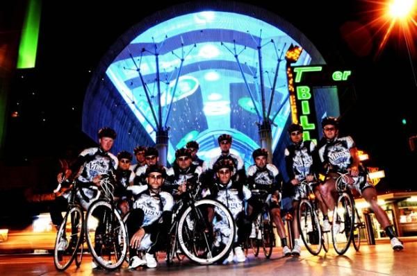 The Adageo Energy Pro Cycling Team pauses for a photo.