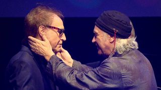 Ray and Dave Davies embrace onstage at the Q Awards in 2018