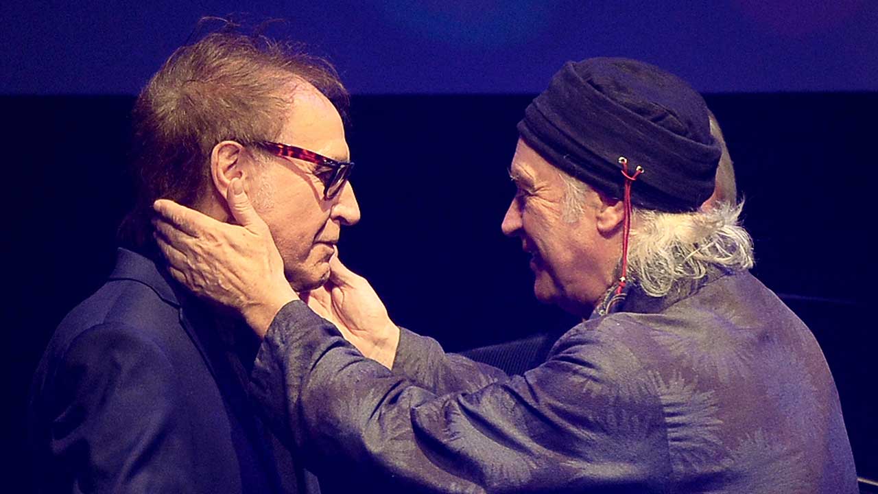 Ray and Dave Davies embrace onstage at the Q Awards in 2018